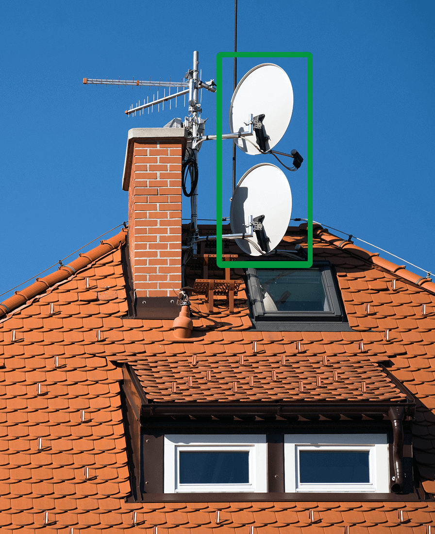 Satellite dishes on the roof of a house