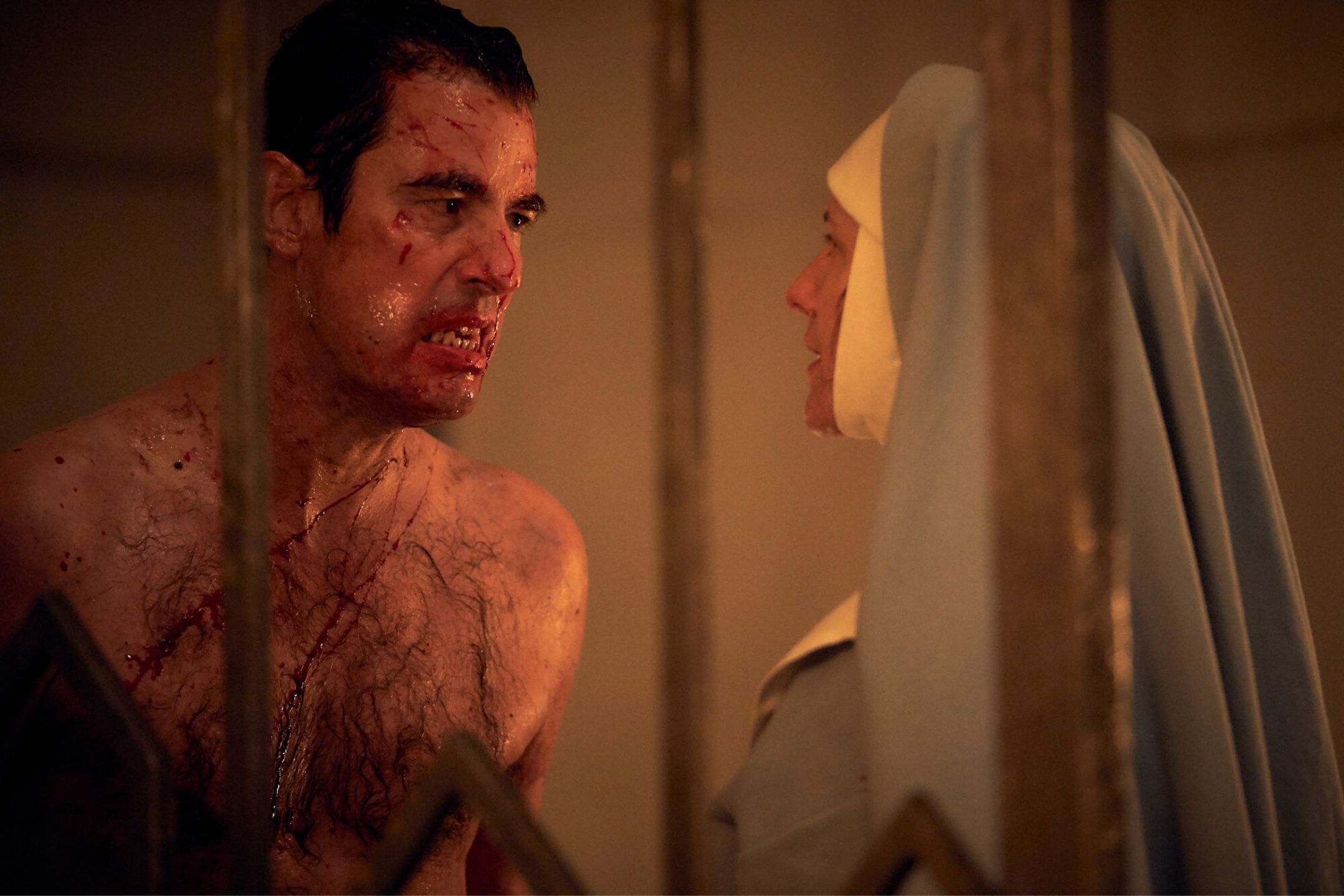 Dracula, covered in flecks of blood confronts a nun