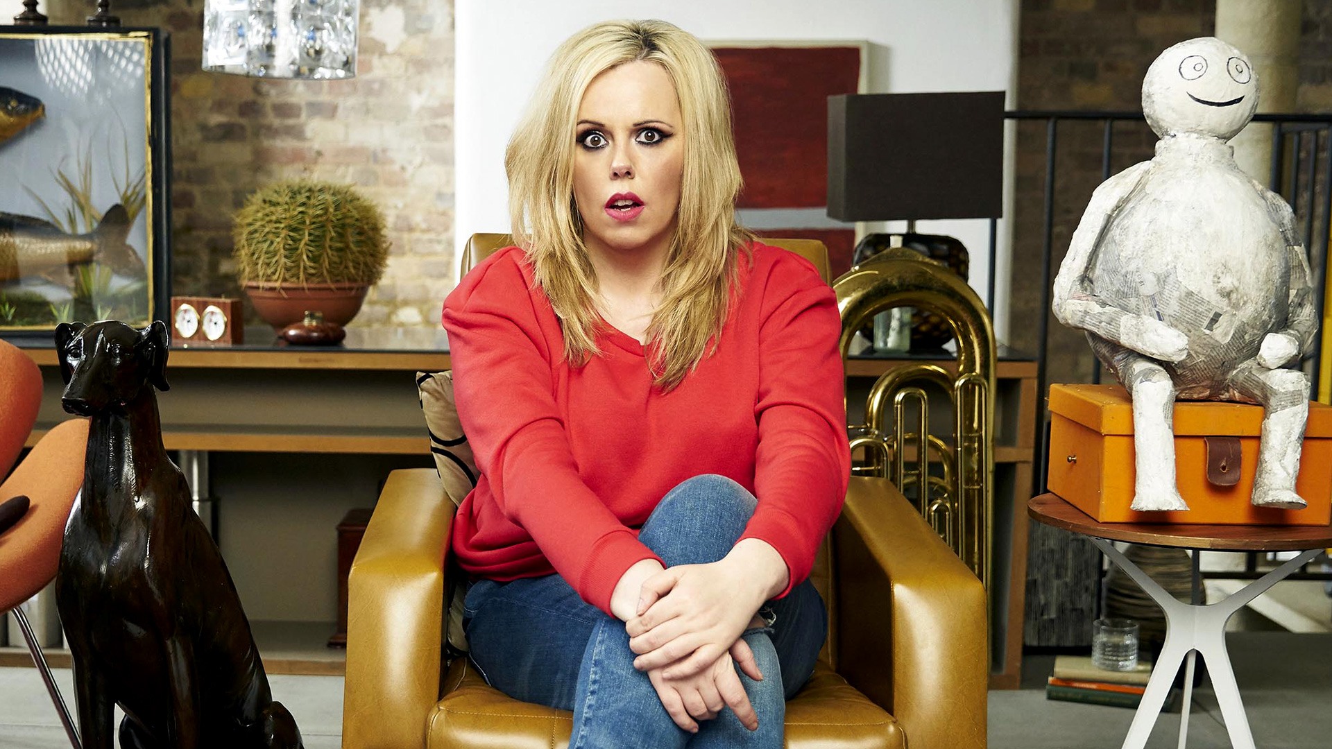 A blonde woman sits in her therapist's office looking slightly dishevelled 