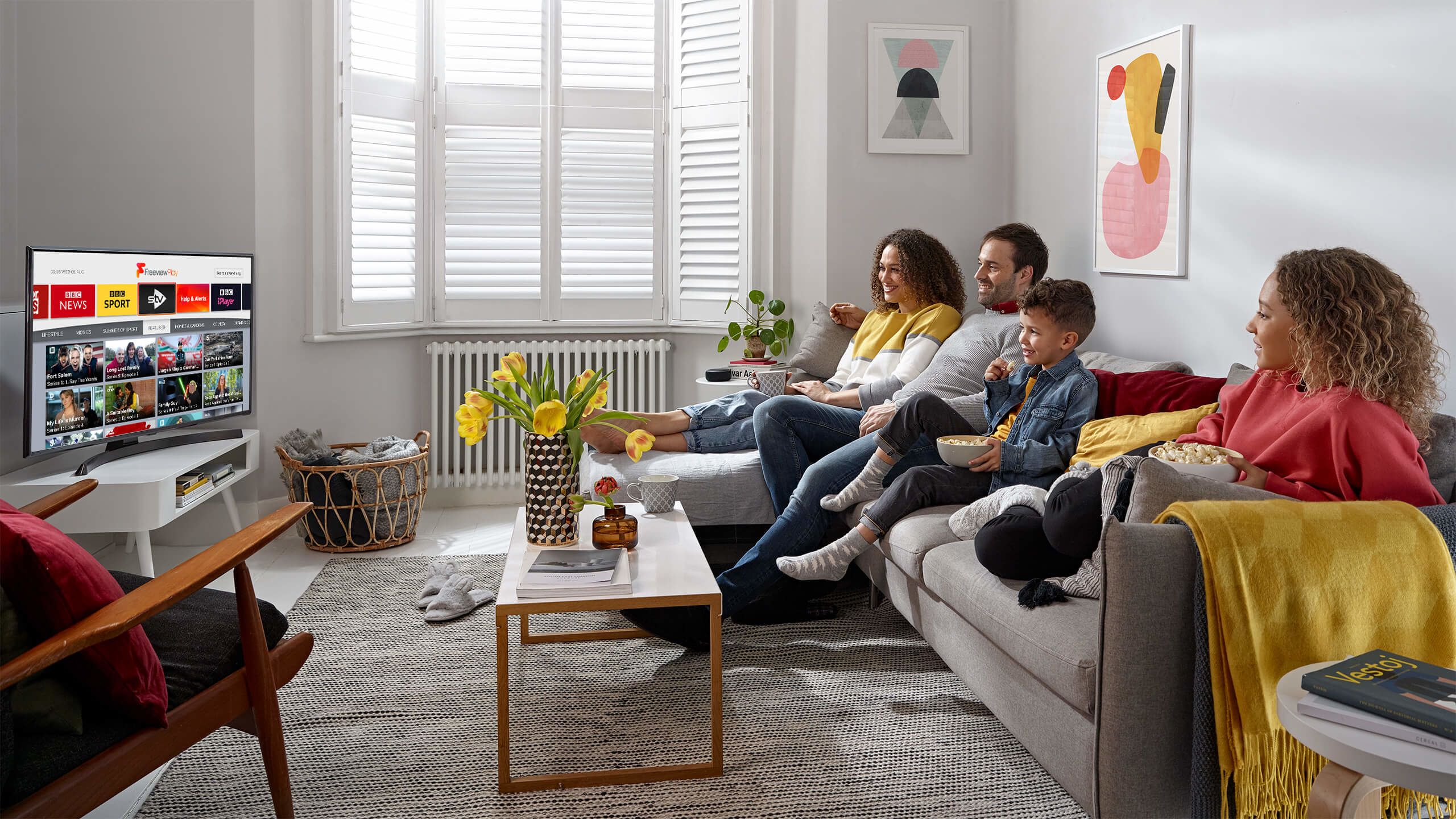 Family group watching Freeview Play