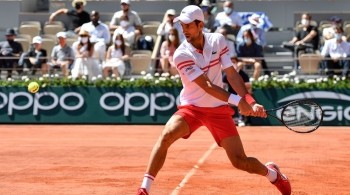 Tennis player about to serve