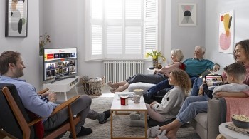 Family of six watching Freeview Play