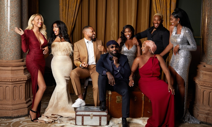 Group of young Black British people glamorously dressed and laughing together