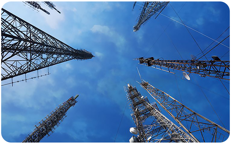 Panoramic view of TV transmitters against blue sky