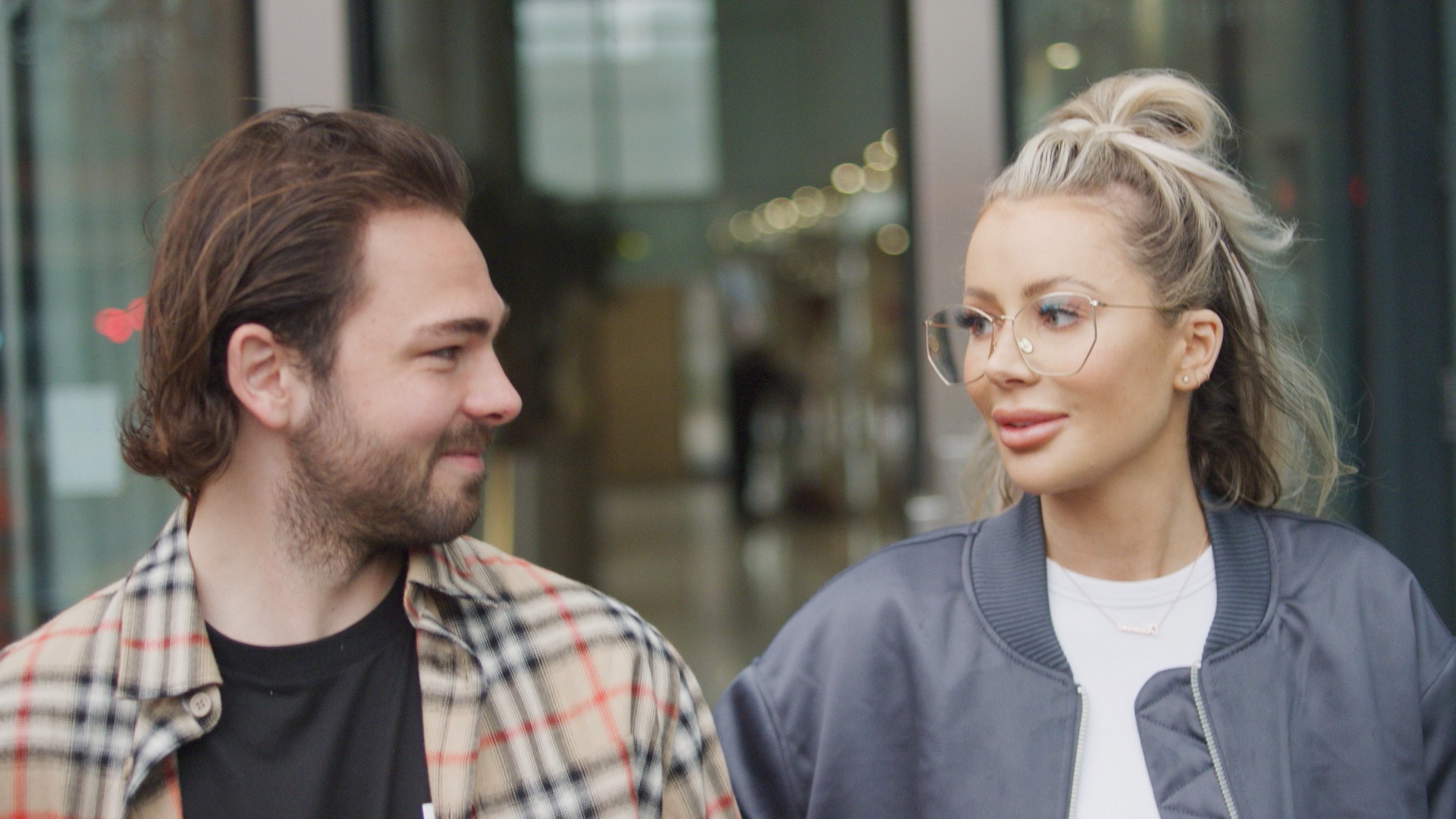 Olivia and her fiance Brad in conversation with each other