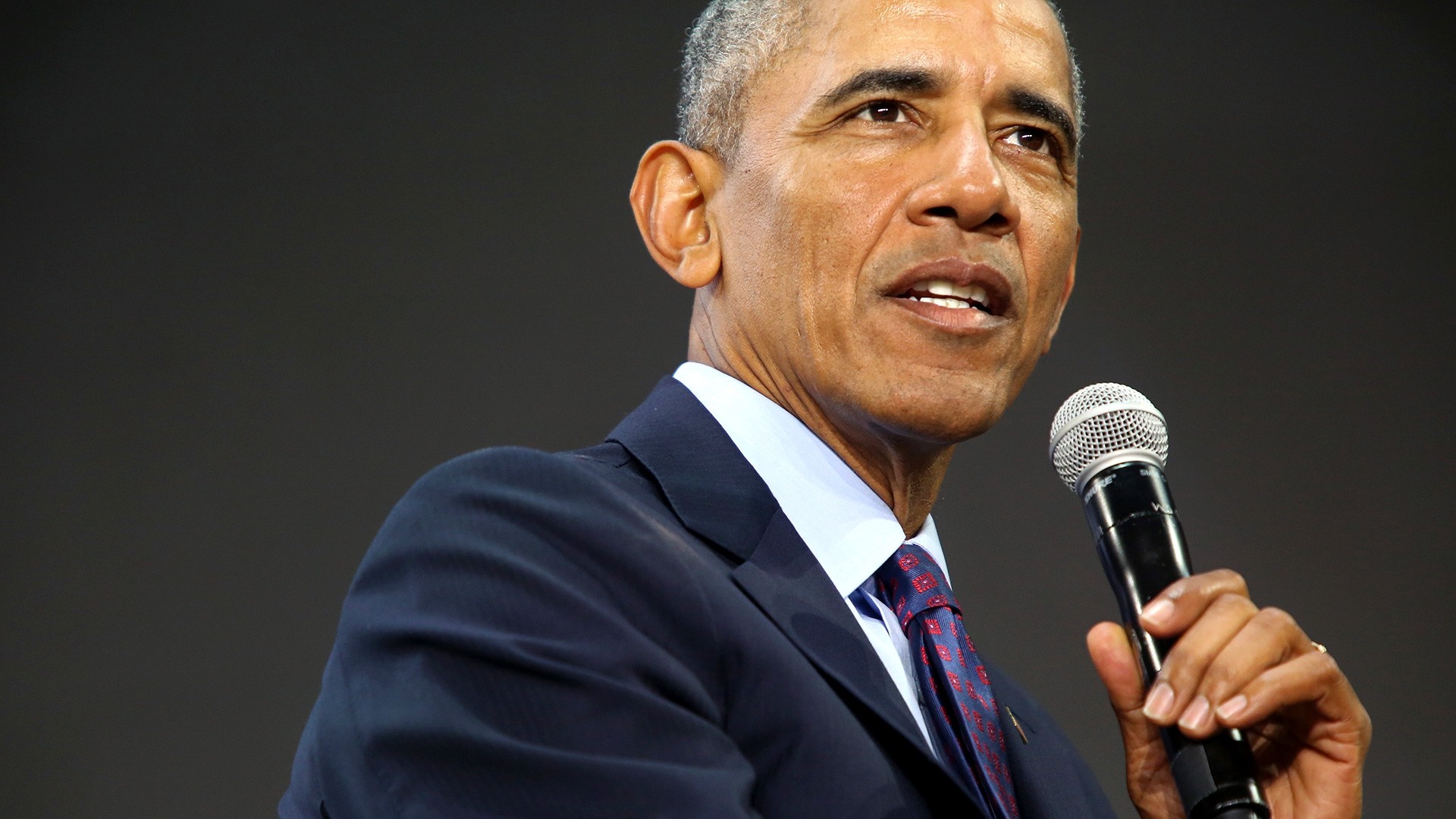 Close up of President Obama speaking into a microphone