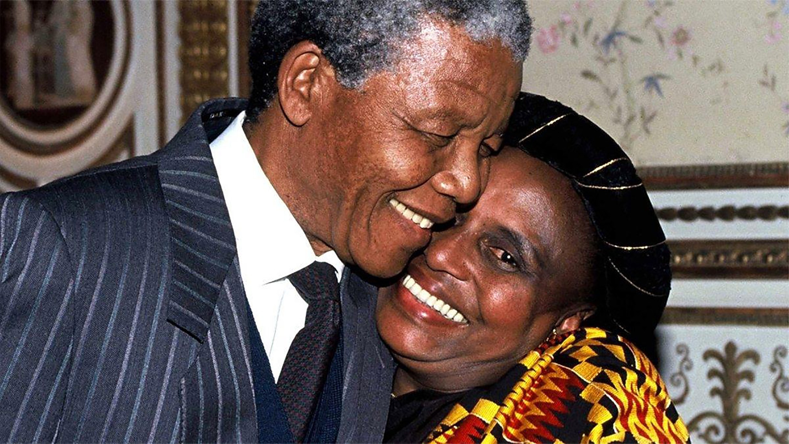 Miriam Makeba and Nelson Mandela smiling towards the camera