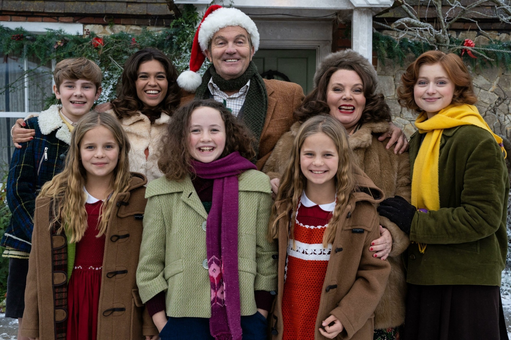 The Larkins Family dressed up for the cold, with santa hats on