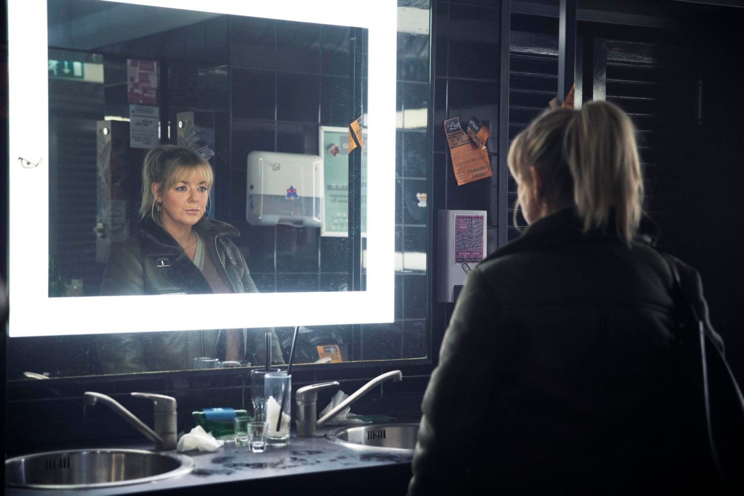 Sheridan Smith as The Teacher, looking at herself in a mirror