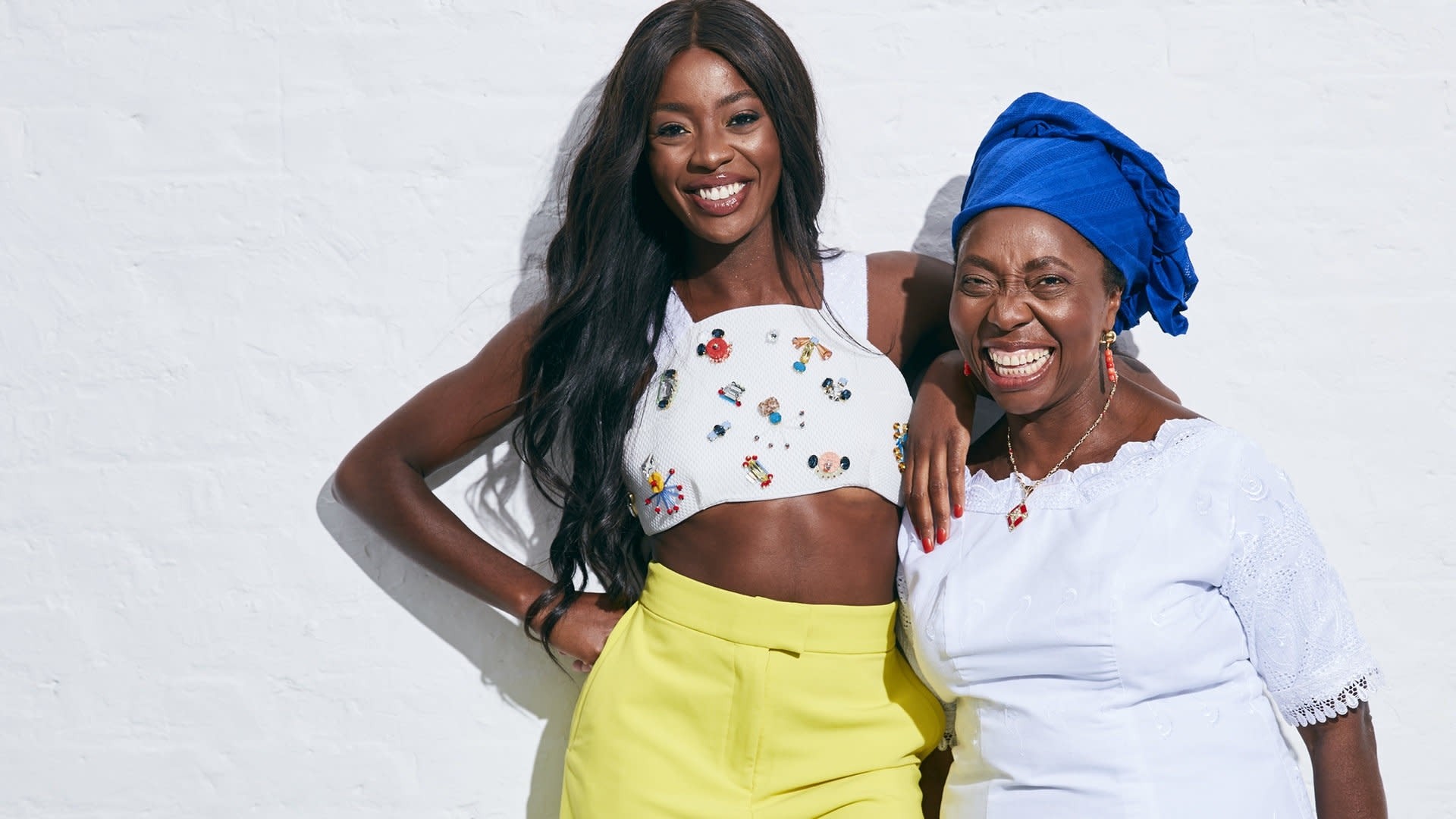 AJ Odudu smiling and laughing with her mum