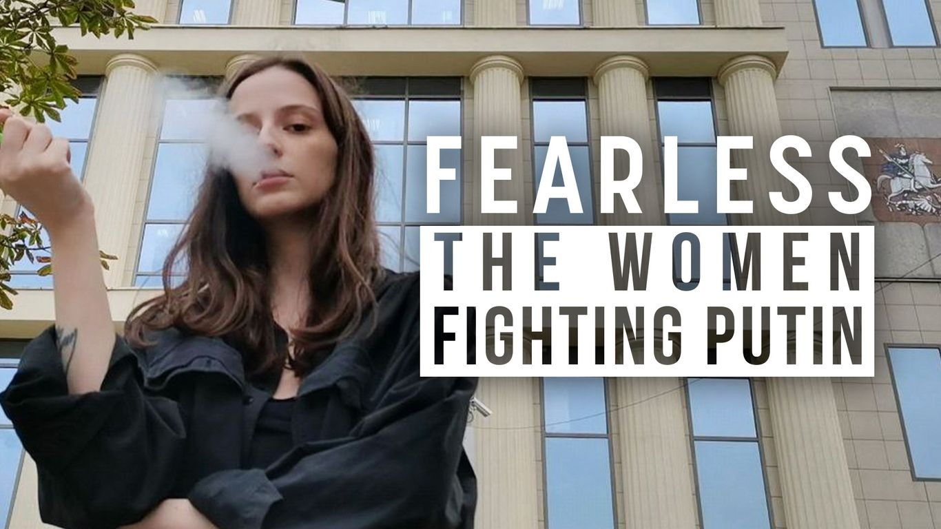 A woman smoking in front of a municipal building, with text reading 'Fearless: The Women Fighting Putin'