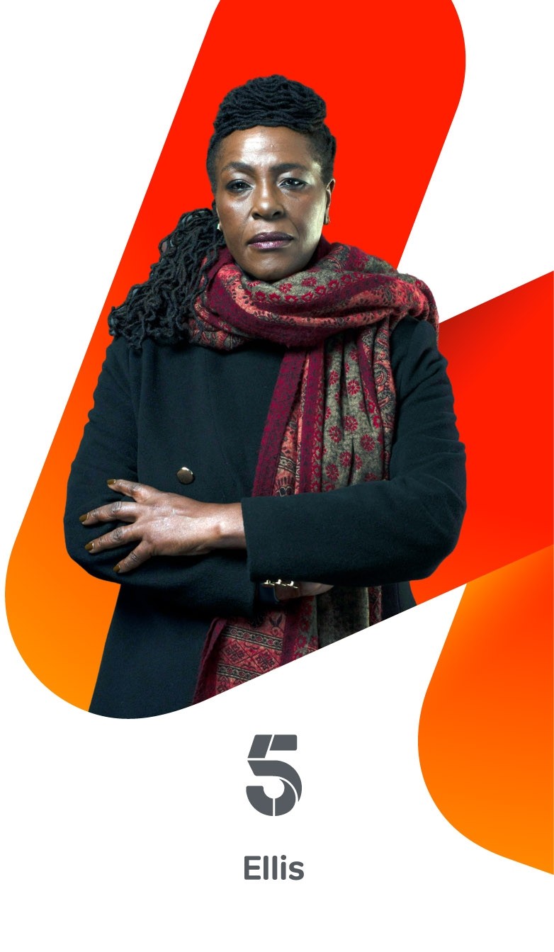 Person wearing a dark coat and patterned burgundy scarf standing with folded arms in front of an orange graphic shape above Channel 5 Ellis branding.