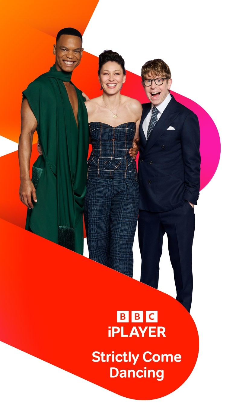 Three people standing together in front of orange and pink graphic shapes above BBC iPlayer Strictly Come Dancing branding.