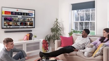 Three young viewers watching Freeview Play on an LG TV